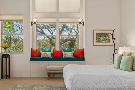 - Read or daydream in this cheerful window seat with plush tropical pillows - Framed by wide windows that offer beautiful green views and plenty of light - Soft bench below provides extra seating for laid back comfort