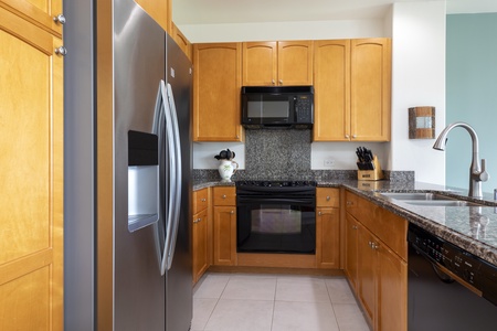 Full kitchen with granite countertops and modern appliances