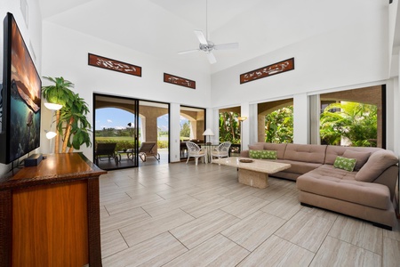 - Bright and airy living space with vaulted ceilings and wall to wall sliding doors - Neutral tones, a plush sectional, and tropical decor create a calm and elegant retreat - Step directly onto the lanai for fresh breezes and beautiful garden views