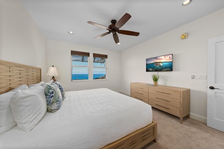 Wake up to stunning ocean views in your serene bedroom sanctuary, where coastal comfort meets modern style.