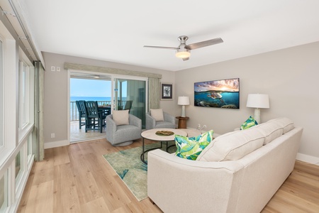 Living room with sliding doors to oceanfront lanai