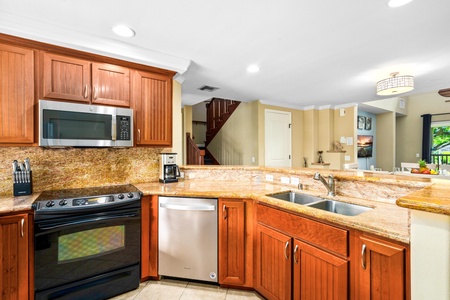 Fully equipped kitchen with granite counters and stainless steel appliances