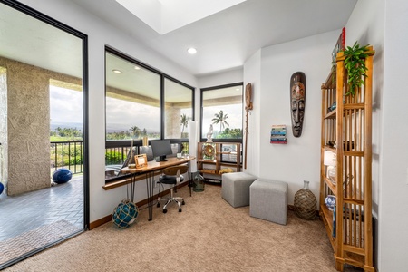 Your productive home office overlooks tropical palm trees, blending work with paradise
