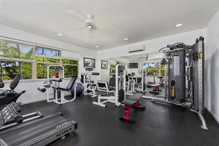 Your private fitness center features professional-grade equipment with air conditioning and natural light to energize your workout routine.