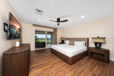 Unwind in your elegant bedroom featuring rich wood floors, luxury linens, and a private balcony with peaceful views.