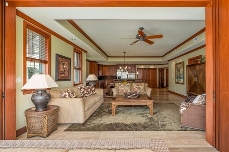 Step into your spacious open-plan retreat, where warm wood accents and island-inspired décor invite you to unwind. The airy living area flows seamlessly into your fully-equipped kitchen, perfect for relaxing evenings at home.