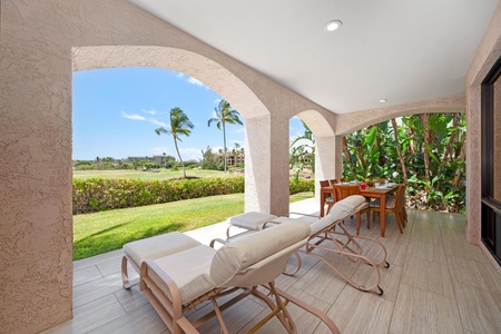 - Recline on cushioned loungers beneath arched shade with views of swaying palms - Adjacent dining table offers an ideal setting for breezy outdoor meals - Gaze out across the beautiful golf course from your private patio retreat