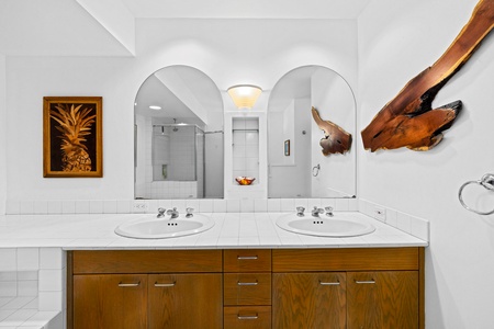 Primary dual-sink bathroom, with plenty of storage.