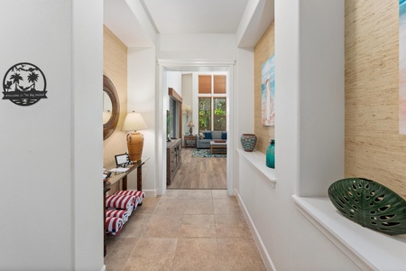 Step into your bright, welcoming hallway where coastal charm meets modern comfort, leading to relaxing spaces filled with natural light.
