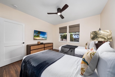 Wake up refreshed in your cozy bedroom with crisp linens, tropical touches, and a ceiling fan to keep you comfortable all night.