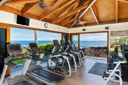 Fully equipped gym overlooking the ocean and black lava cliffs.