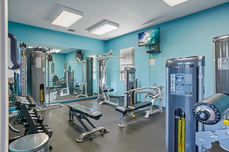 Work up a sweat in your own well-equipped fitness center with strength and cardio machines, free weights, and energizing turquoise walls to keep you motivated.