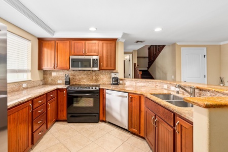 Fully equipped kitchen with granite counters and stainless steel appliances