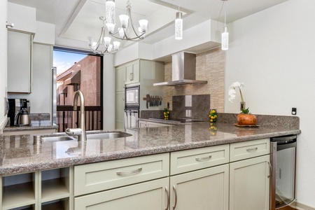 Full kitchen with modern appliances and granite countertops