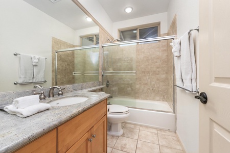 Step into your spa-like bathroom with granite counters, deep soaking tub, and fluffy towels waiting for your arrival.