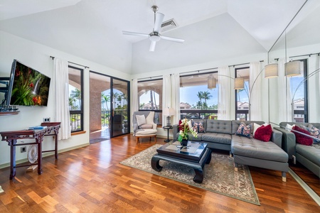 Living room with vaulted ceiling and outdoor access