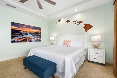 Drift off to sleep in your serene retreat, where coastal artwork and island-inspired decor create the perfect tropical escape.