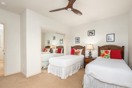 Your twin bedroom offers crisp white linens with tropical accents and a stylish ceiling fan to keep you comfortable.