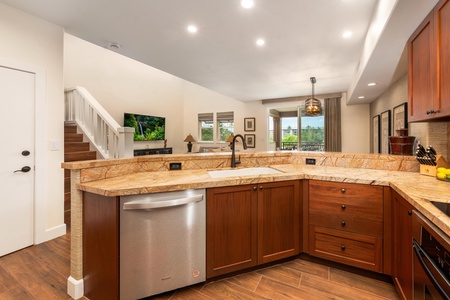 Your stunning kitchen features granite counters, rich wood cabinets, and top-tier appliances—perfect for creating memorable meals during your stay.