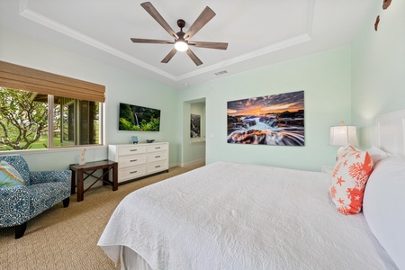 Unwind in your peaceful bedroom sanctuary with calming coastal decor, comfortable seating, and stunning nature artwork creating the perfect tropical retreat atmosphere.