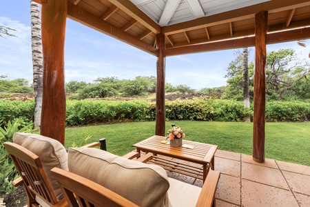 Your private covered patio offers peaceful garden views where you can unwind with morning coffee or evening relaxation.