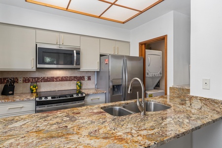 Your fully equipped kitchen features granite counters, stainless steel appliances, and convenient in-unit laundry—making it easy to feel at home during your stay.