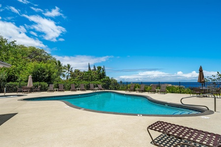 Sparkling pool under clear blue skies.