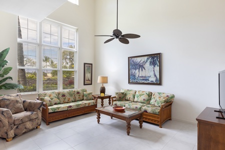 Living room with vaulted ceilings and tall windows