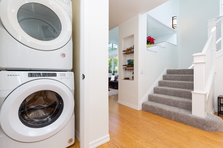 - Convenient laundry nook with stacked washer and dryer just steps from the main level - Easily freshen up clothes and beach towels without leaving the comfort of home - Located near the staircase for quick access while on the go