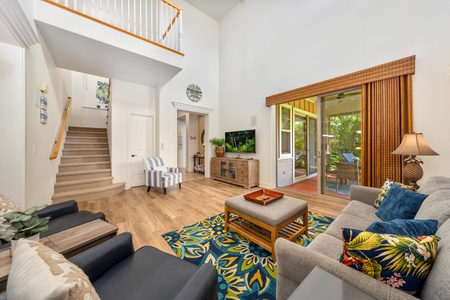 Unwind in your bright, airy living space with soaring ceilings, tropical touches, and sliding doors to your private patio paradise.