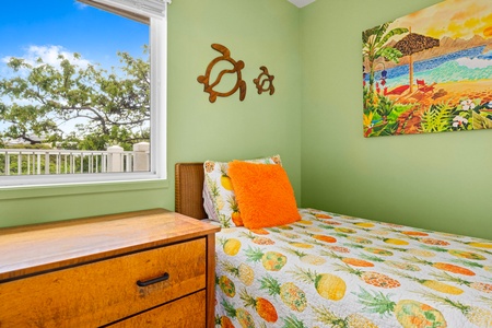 Wake up to tropical vibes in your cozy bedroom, where cheerful décor and leafy views set the perfect island escape mood.