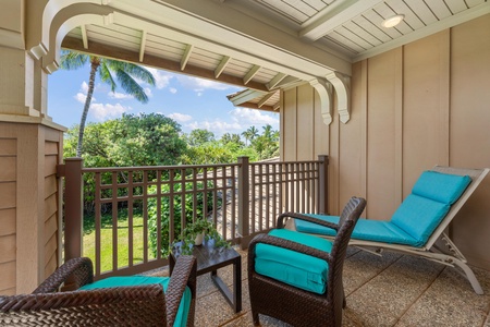 Sink into turquoise cushions on your private balcony, where tropical breezes and lush garden views create your perfect morning coffee retreat.