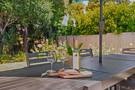 Picture yourself savoring wine and charcuterie on your private patio, surrounded by lush gardens and elegant orchids.