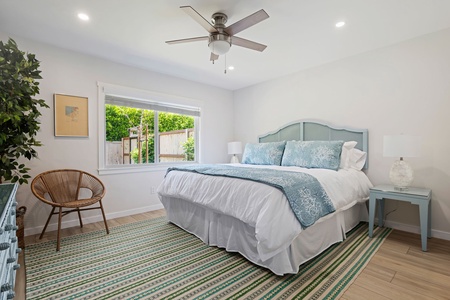 Your serene bedroom offers crisp linens, gentle ceiling fan breezes, and peaceful garden views for restful nights.