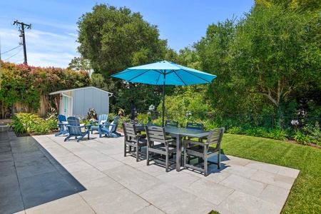 Your private patio oasis features dining for six under shade, plus cozy lounge chairs surrounded by lush gardens.