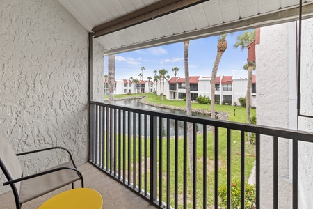 Balcony With Table And Chairs To Enjoy Palm Tree Scenery