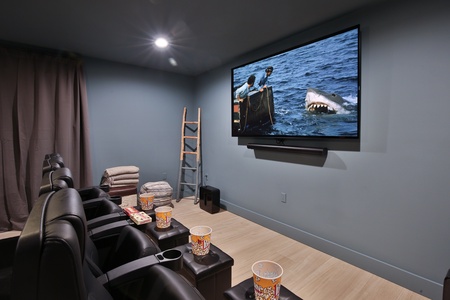 Movie Theatre Enjoy a movie or the big game in this theatre setting, with an 85" OLED TV with full sonos surround sound!