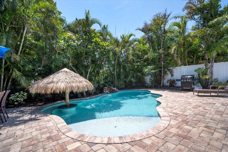 Backyard Oasis Beautiful 3 Bedroom home with private pool and swim up tiki, 3 minute walk to beach with no busy streets to cross!