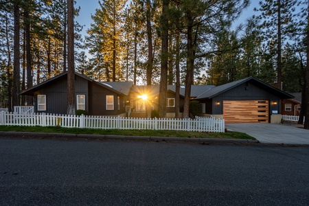 Front of home highlighted by setting sun