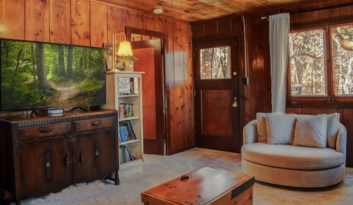 Door to fenced back yard with seating