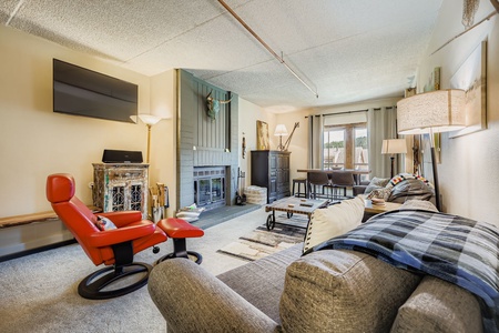 Bright and Open Living Room with a Cozy Fireplace.