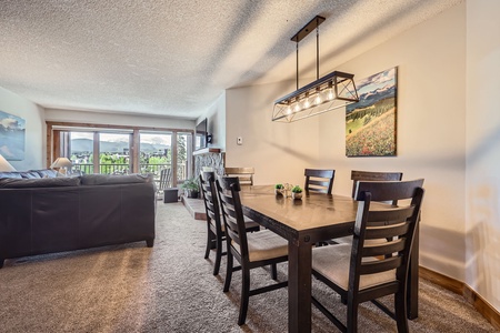 Cozy dining space with plenty of natural light and a stunning balcony view — perfect for meals with a breeze and a view!