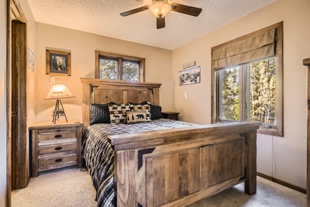 Main level queen bedroom with attached bathroom.