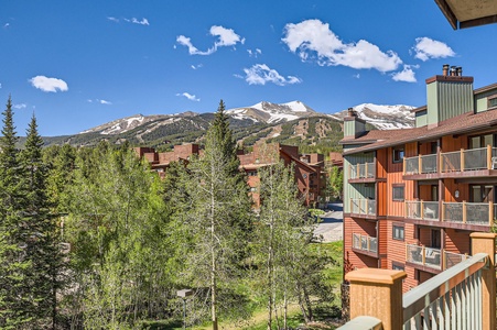Relax on the balcony with comfortable seating and breathtaking views of the town and mountains — your perfect spot to unwind and soak it all in!