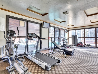 Fitness room at Copper Chase offers treadmills, elliptical machine, weights and more