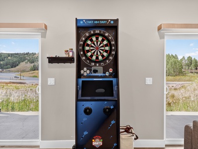 Game room with electronic dart machine, arcade games and TV lounge area