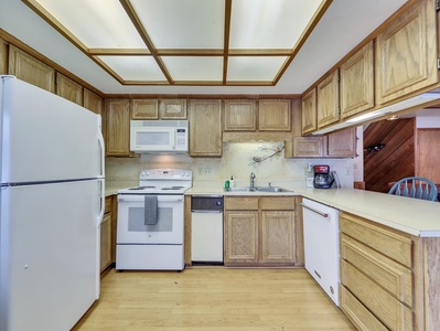 View of the fully equipped kitchen, perfect for preparing meals and enjoying a cozy night in after a day on the slopes