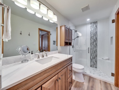 View of the newly remodeled primary bathroom, featuring modern upgrades and a fresh, inviting design