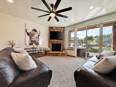 View of Great Room Overlooking Brian Head Pond and Private Deck with Jacuzzi.  54" Smart TV, Natural Gas Fireplace