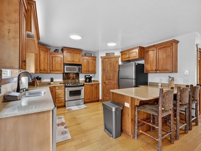 View of the fully stocked kitchen with everything you need for cooking and dining on the mountain